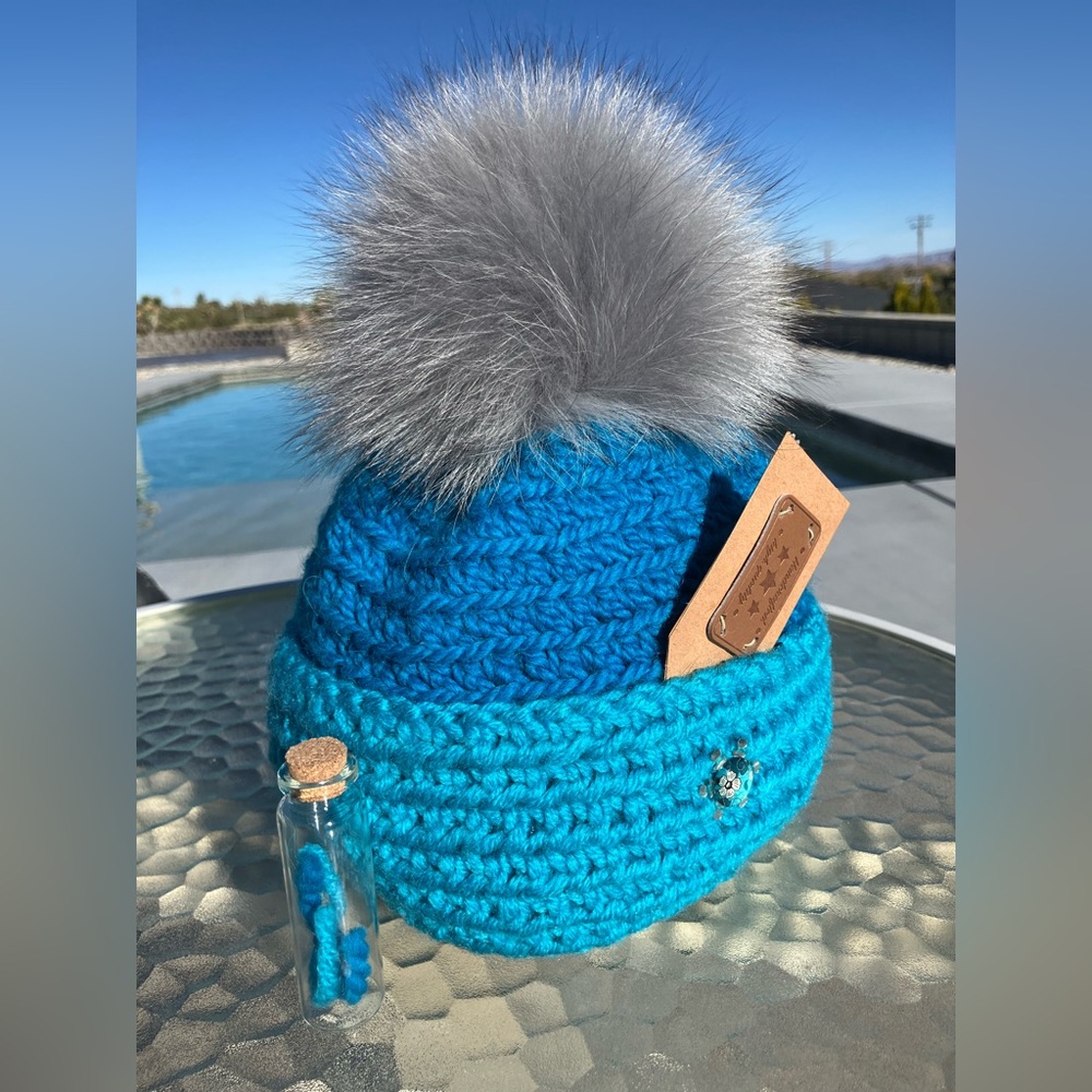 Vibrant Blue Knit Hat with Fluffy Natural Pom-Pom